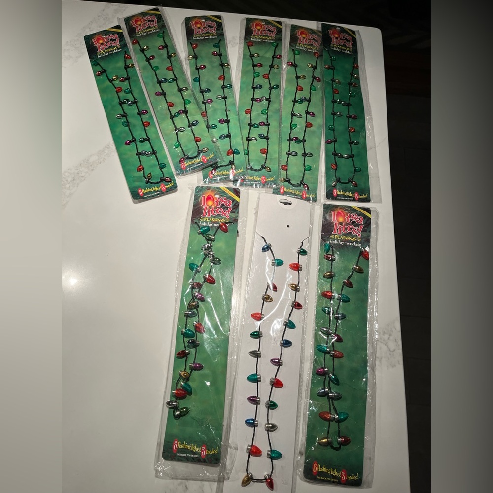 NWT 9 Christmas flashing light up necklaces!  Really cute.